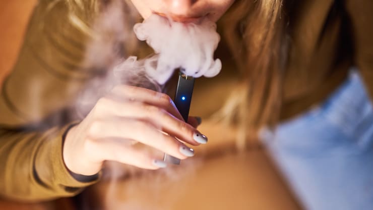Photo depiction of teenage e-cigarette usage. Gabby Jones | Bloomberg | Getty Images