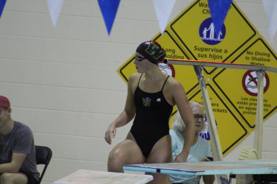 Scarlet+Martin%2C+Sophomore%2C+gets+ready+to+swim+in+a+meet+on+September+24th+against+City+High+School.+
