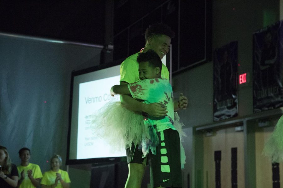 During the 2020 Dance Marathon, Kaleb Williams hugs his cousin, Aidan, who has leukemia. 