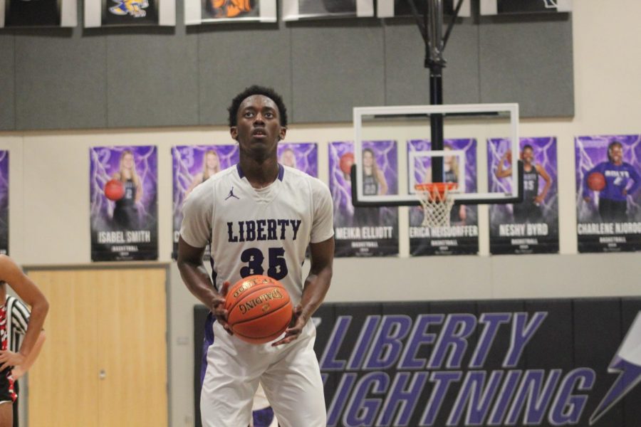 Senior Andre Brandon shoots a free throw in a game at Liberty High School