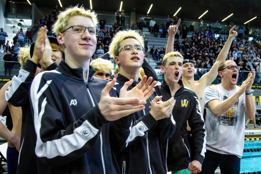 The swim team celebrates during the state meet.