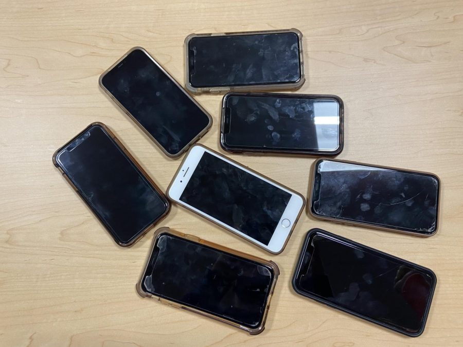 Students phones being shown during a class used for non-school related work.