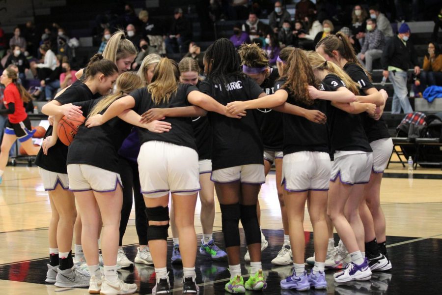 The+Liberty+Girls+Varsity+Basketball+team+huddling+up+before+they+take+on+the+Warriors.+