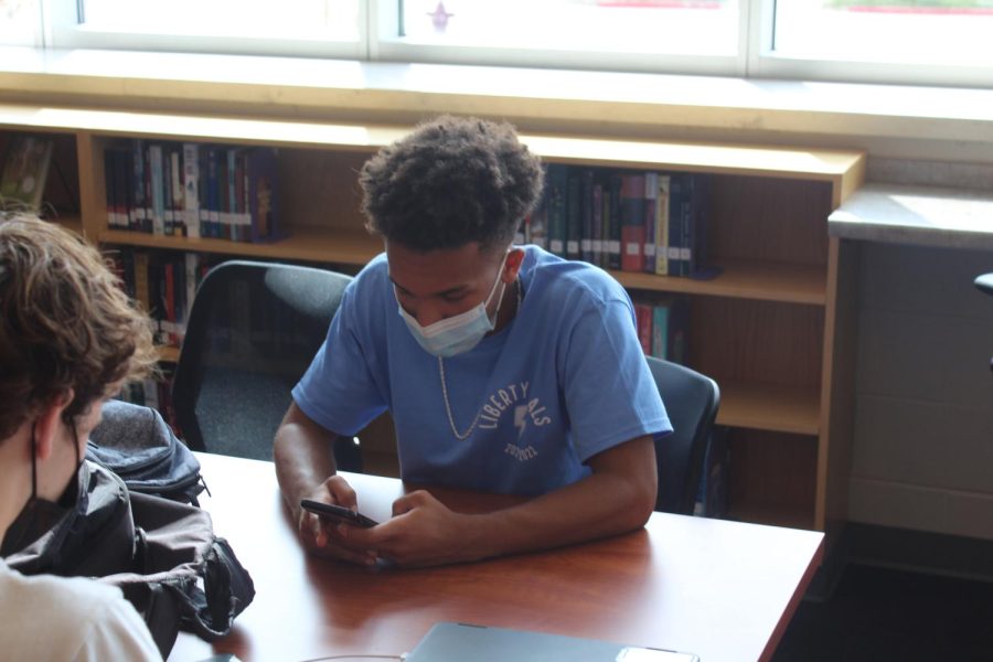 Jalen Wieck, junior, spending time with friends in the library during his free period.