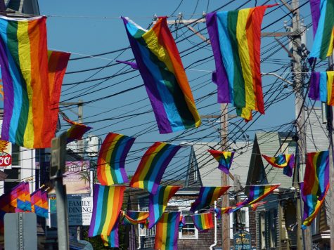 Many pride flags displayed on Commercial Street, in Provincetown, Massachusetts. (Creative Commons Image)