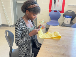 Ruth Zamba, freshman, loves crocheting 
accessories and clothes. Zamba is currently 
crocheting her new project.