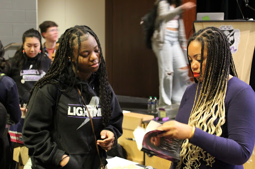 Jackson talking to a Liberty student about her book White Smoke. 