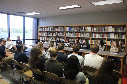 Foreign exchange students from across Iowa, including Liberty student Agathe Scherpereel, answer including questions for the International Round Table Day hosted at Xaiver High School.