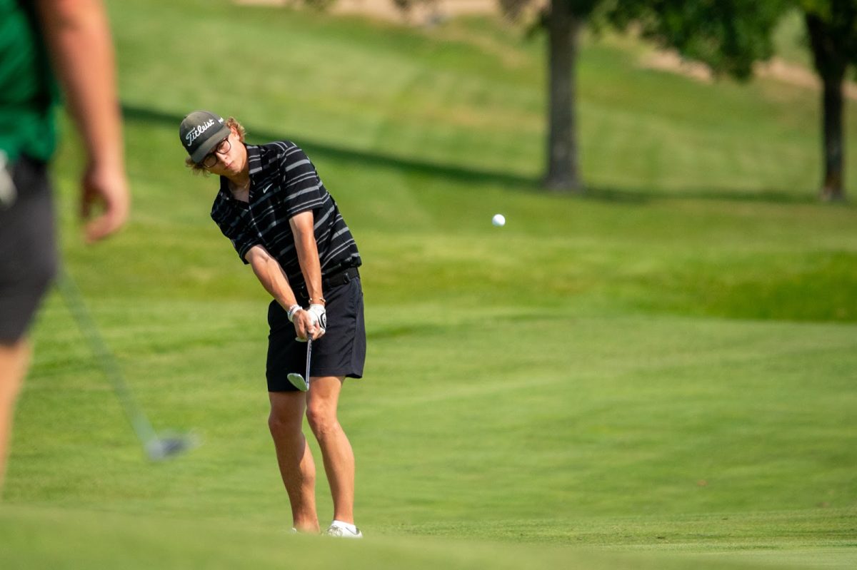 Brody Heddens, 12 makes a putt in on the green. 