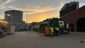 The day following the Hawkeyes' game against Washington, students from the Iowa City area arrive to clean up the stadium.