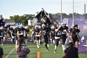 The Liberty Lightning Football Team storms the field as they get ready to take on the home game.