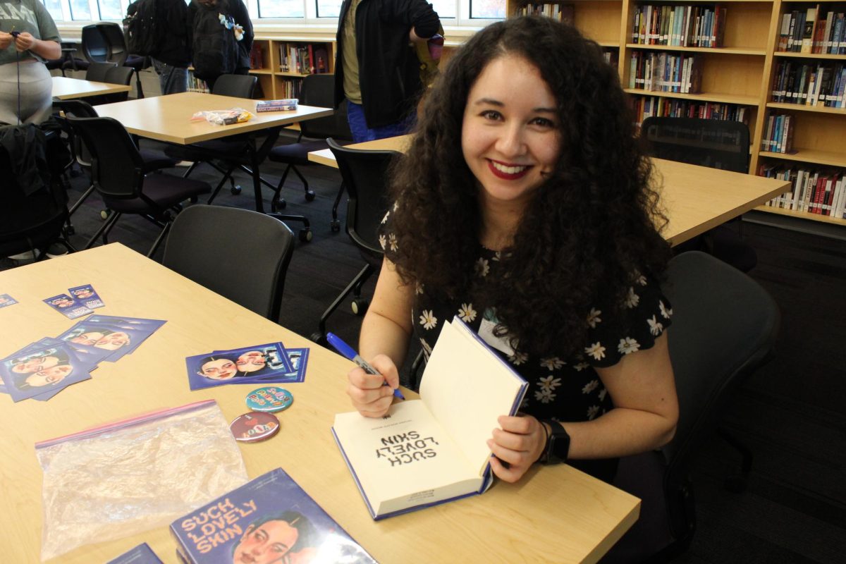 Tatiana handed out bookmarks, stickers and cards of her book at the meeting she had with the Library Leaders. (photo given with permission from Leah Carlson)