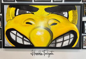 With food and extensive Iowa memorabilia, “The Humble Tailgate” features rooftop seating on the garage. 