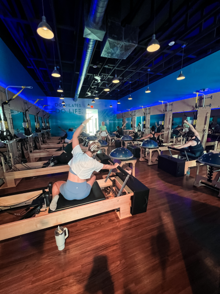 Club Pilates offers classes using a reformer, a resistance machine designed for low-impact strength training. 