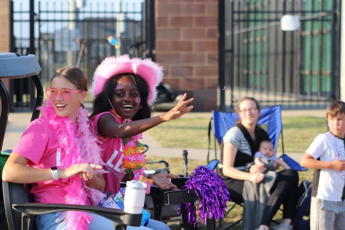 Paige Lambi, 12, and Rebecca Matiyabo, 12, deck out in all pink to promote the Liberty National Honor Society.