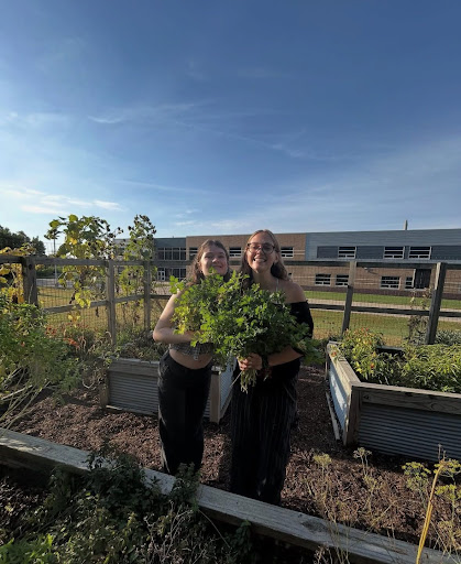 Members of the Garden/SEA club are given hands-on experience in Liberty’s garden.